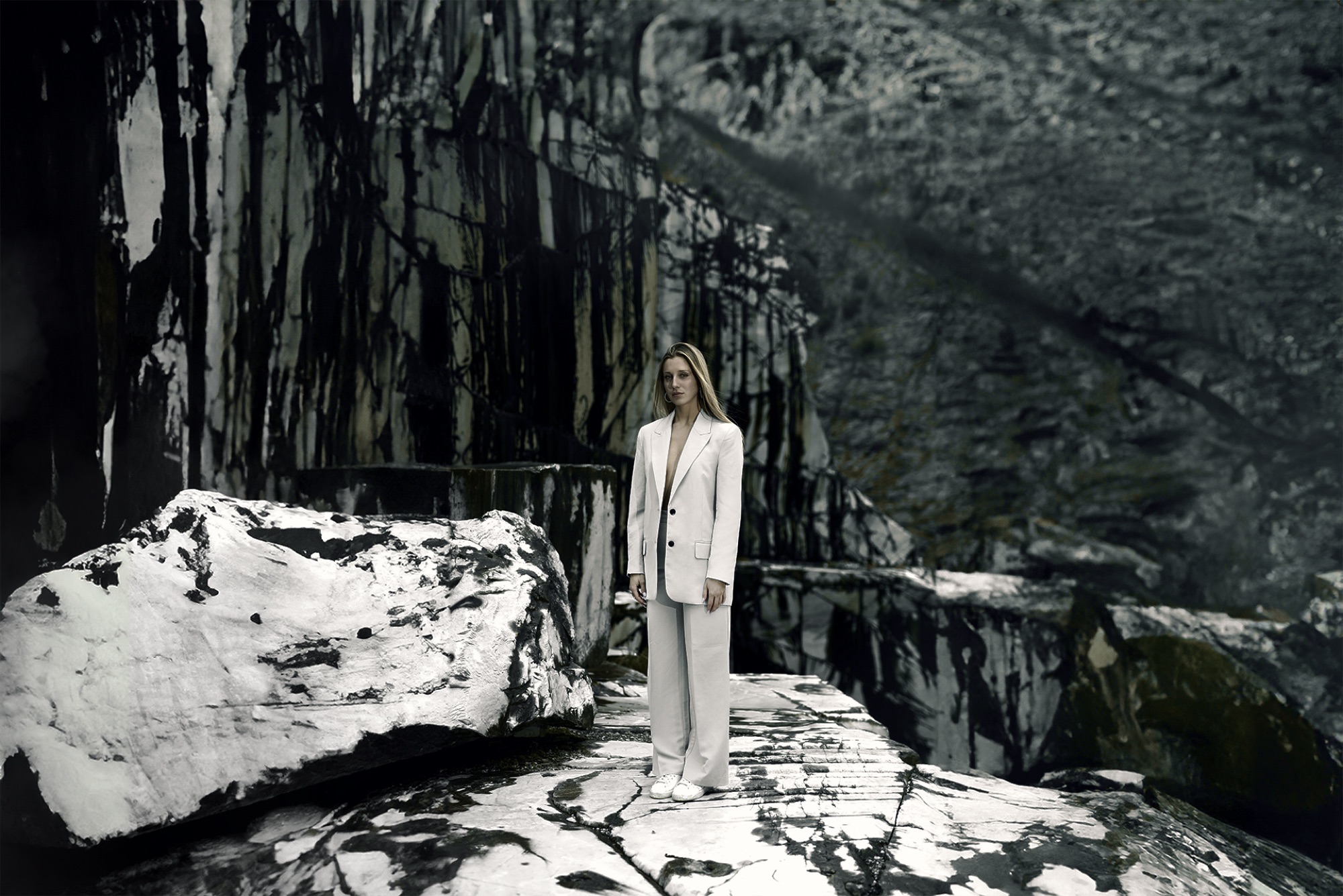 Model at Massa Carrara quarries in white clothing
